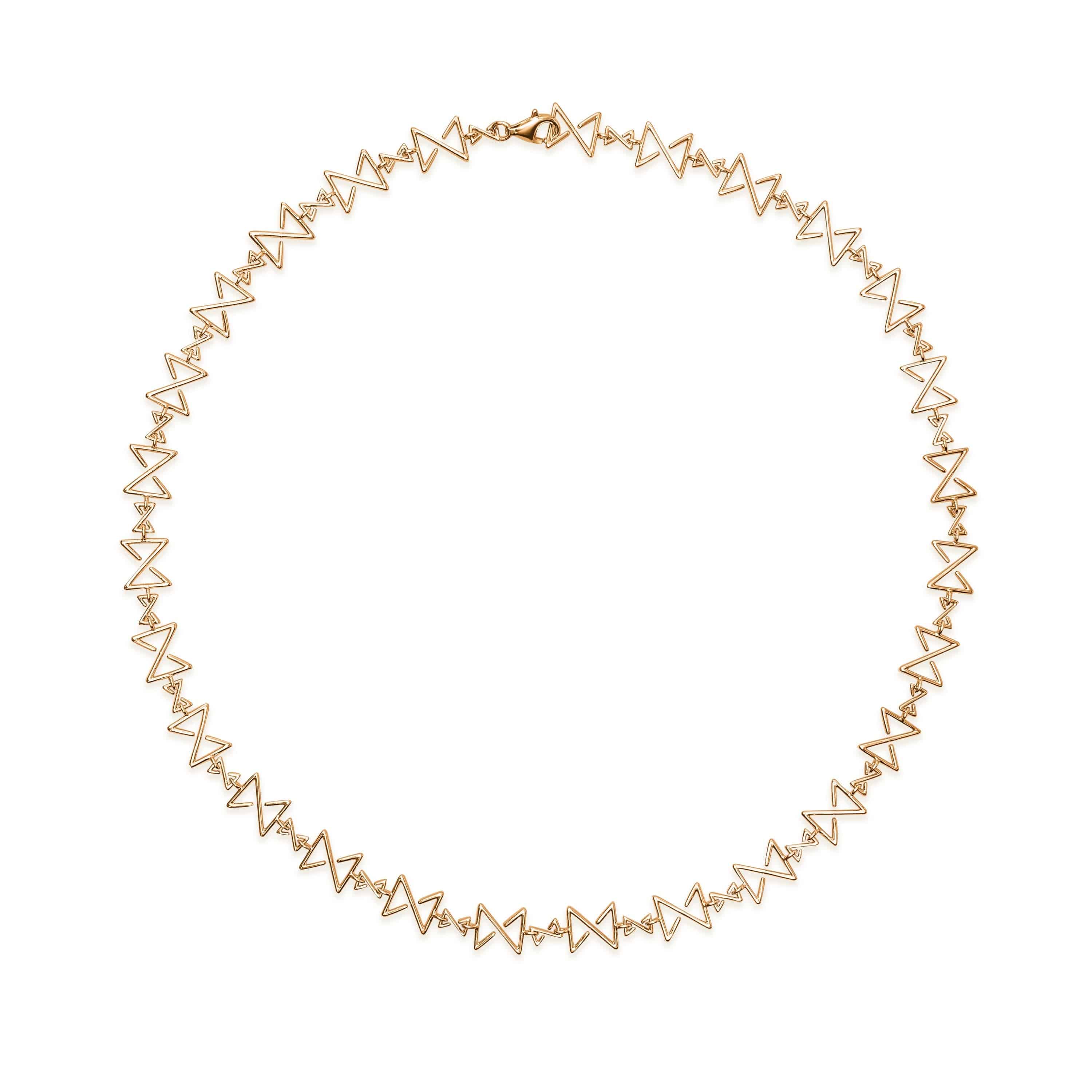 Reviewing a beautifully engraved dentalium necklace with
